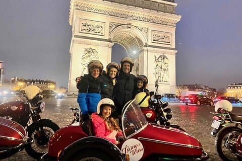 A family of five enjoy Paris illuminated at night!