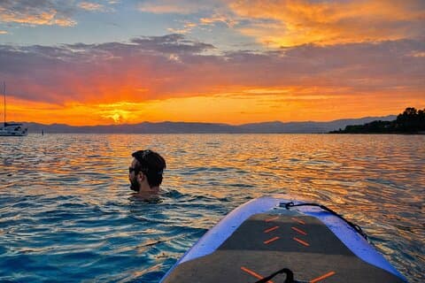 Swimming and relaxing in golden sunset waters