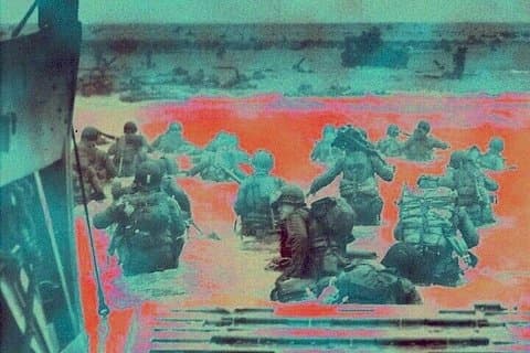 Soldiers and officers of the "Big Red One" (the American 1st Infantry Division) landing on Omaha Beach, in the early hours of D-Day, June 6 1944.
