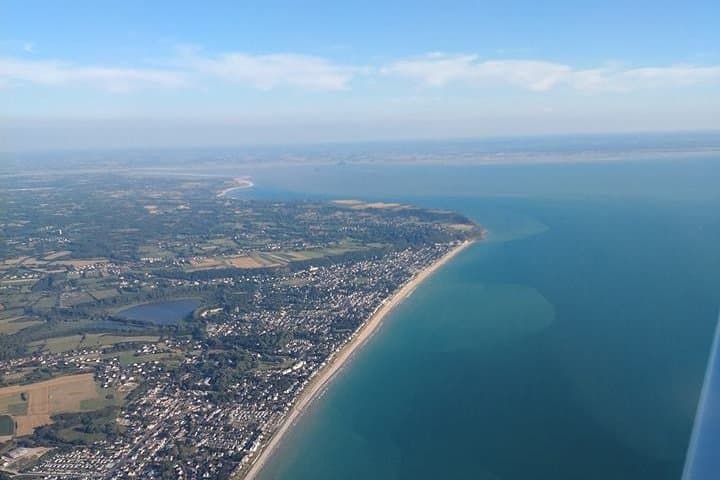 Fly above Normandy's hallowed coastline in a private plane