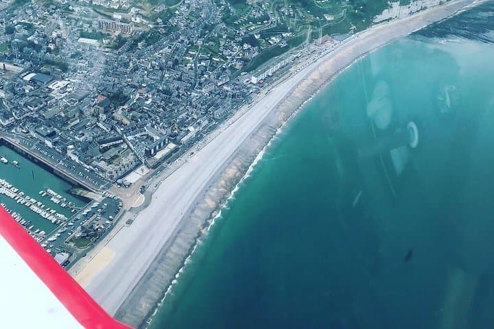 Fly above Normandy's hallowed coastline in a private plane