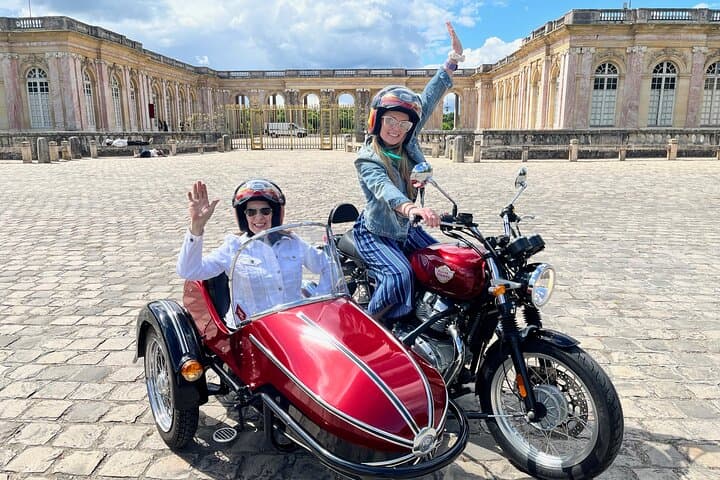 Mother and daughter parked in front of the Grand Trianon Palace