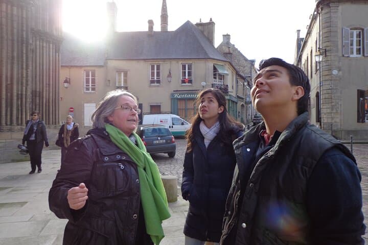 Marie-Noëlle explaining her guests on a private tour the details on the Bayeux cathedral