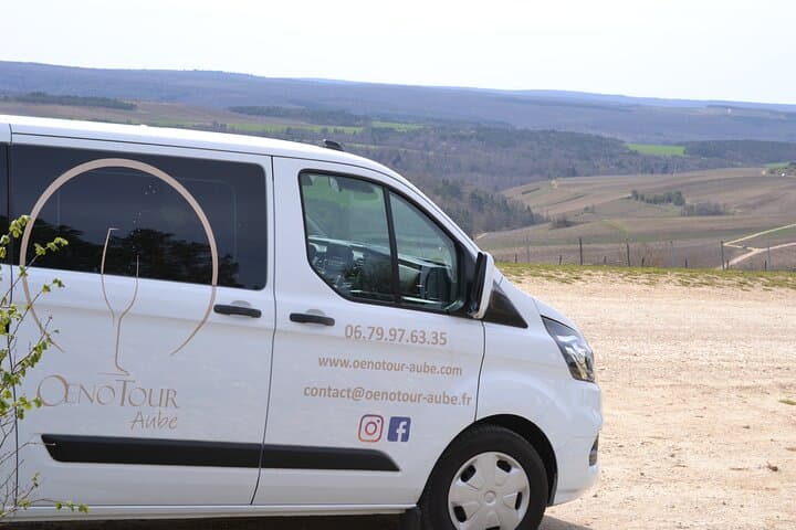 transport in a new hybrid Van with tinted windows with 8 customer seats and the driver