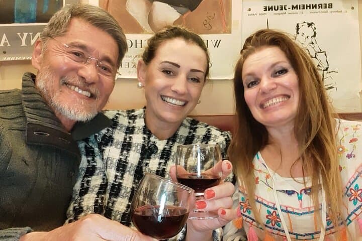 With kind guests on the local bar tasting cheese and wine .
