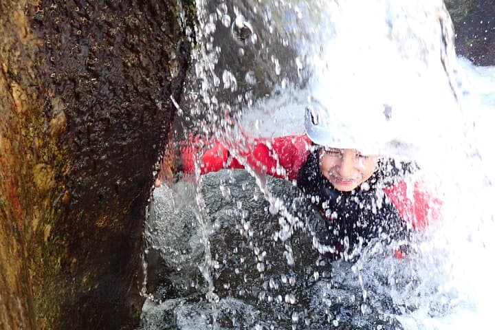 swim under the waterfall