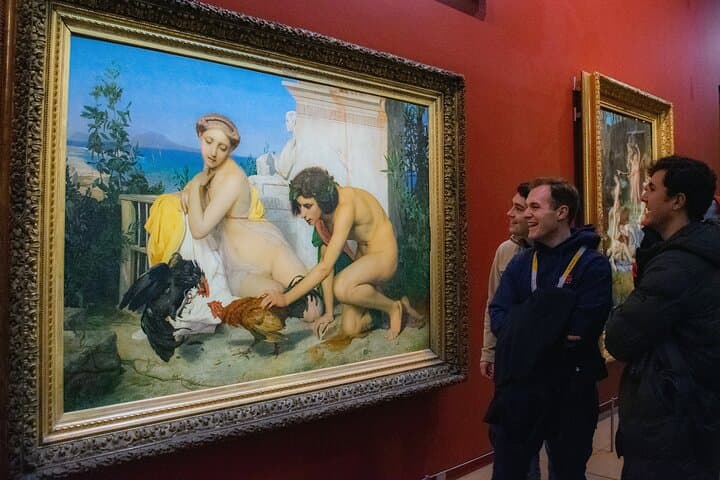 People laughthing in front of a painting at the Musée d'Orsay