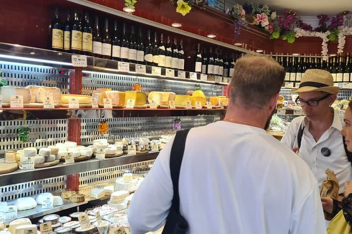 Selecting the best cheeses at Rue des Martyrs