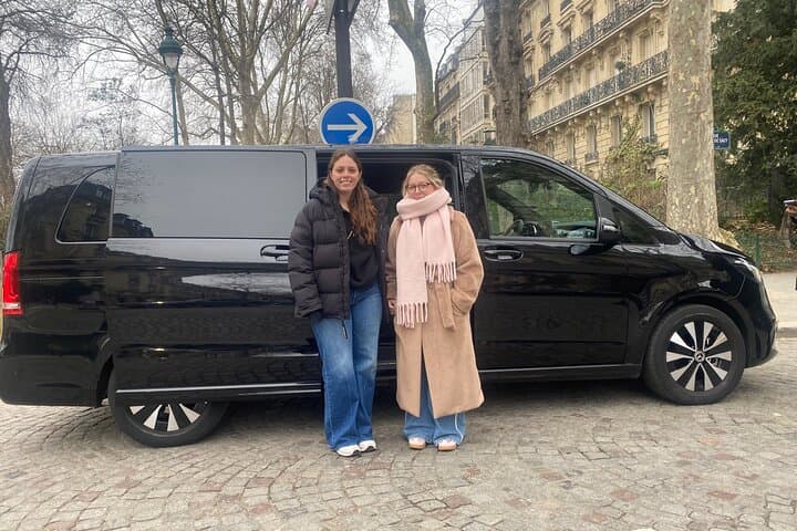 Other wonderful guests, amazing ladies, in front of the van at the Champs de Mars, with the Eiffel Tower gardens around them.