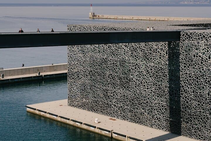 Photography of concrete mesh credited to: © Architects Rudy Ricciotti and Roland Carta / Mucem.