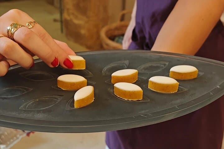 Two people run a calisson d’Aix in a large calisson factory in the world, emblematic specialty of Aix-en-Provence.