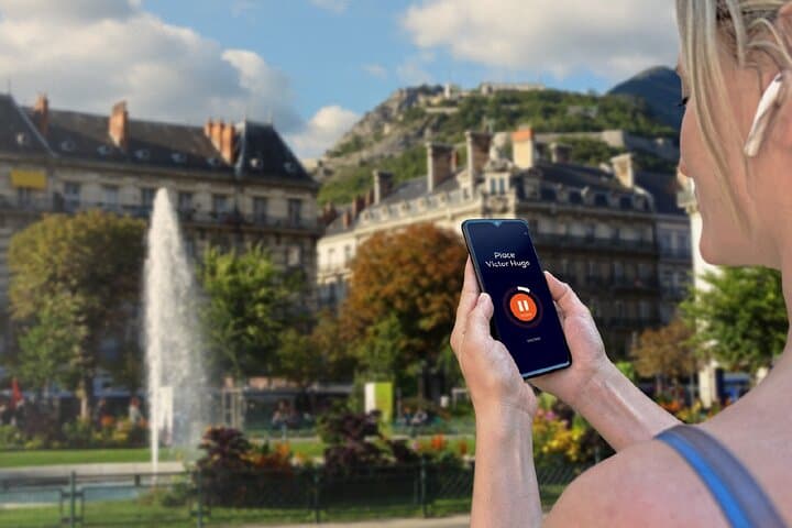 Visit Grenoble in freedom: Place Victor Hugo, the elegant heart of the city with its fountains.