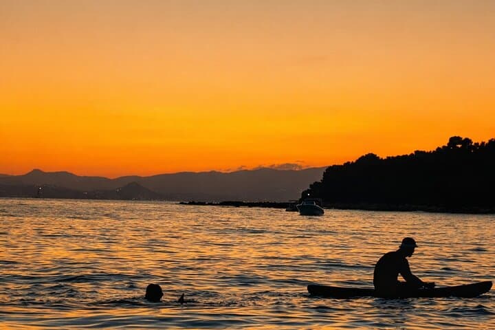 “Swimming stop in a quiet sunset cove”