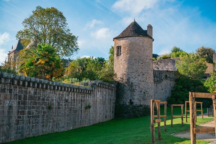 Retreat Garden: An oasis of greenery and palm trees nestled at the foot of the medieval ramparts.