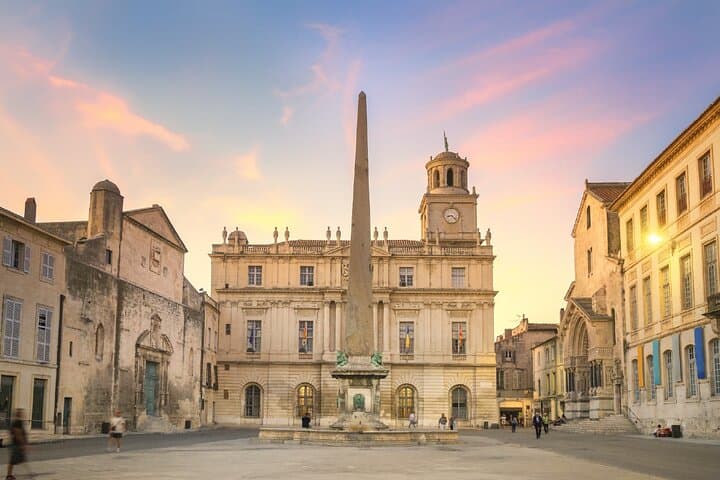 Place de la République: The ancient obelisk sits in the centre of the square, surrounded by the Town Inn and the Church of Saint-Trophime.