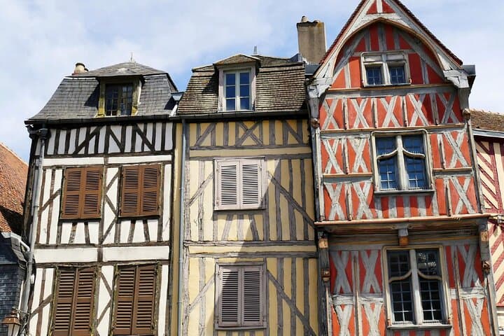 Medieval Architecture: The colourful facades and exposed beams of historic houses in the city centre.