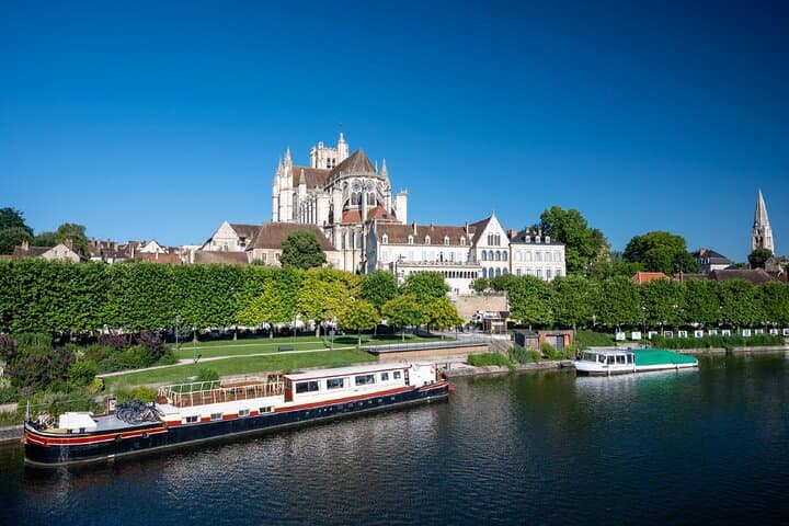 The Quays of the Yonne: Superb views of the Abbey of Saint-Germain and the Cathedral of Saint-Étienne reflected in the river.