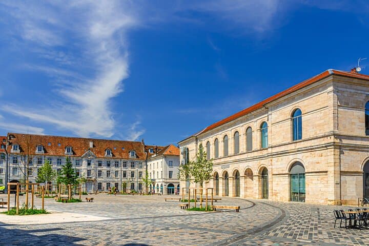 Revolution Square: The elegance of Chailluz stone architecture (typical two-tone stone) on this vast central square.