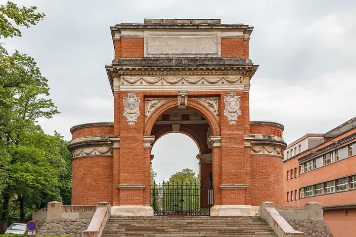 Arsenal Gate: The monumental red brick arch marking the entrance to the garden.