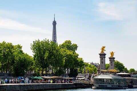 River bank with bridge and Eiffel Tower in the background
