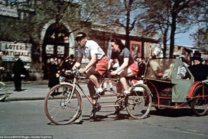 A velo taxi, one of the more popular ways of getting around due to the petrol shortages France received ponly 10% of its pre war oil supplies and the Germans only issued permits for 3500 cars