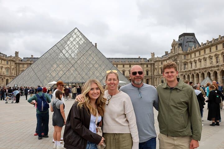 We'll stop at the Louvre to admire the stunning glass pyramid and capture unforgettable photos from the outside.
