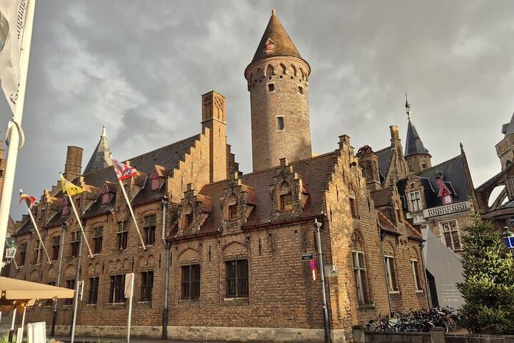 Bruges Private Tour from Paris with Champagne and Canal Cruise