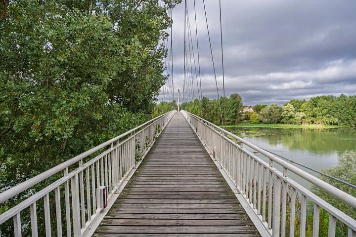Bridge on the Garonne: A suspended walk offering a unique view of the river.